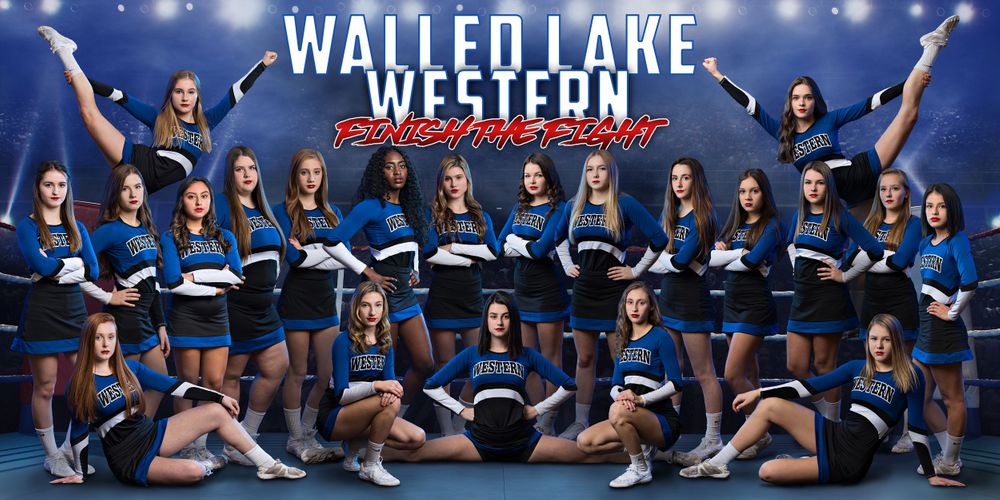 Walled Lake Western high school cheerleading squad poses in blue uniforms for team banner photo.