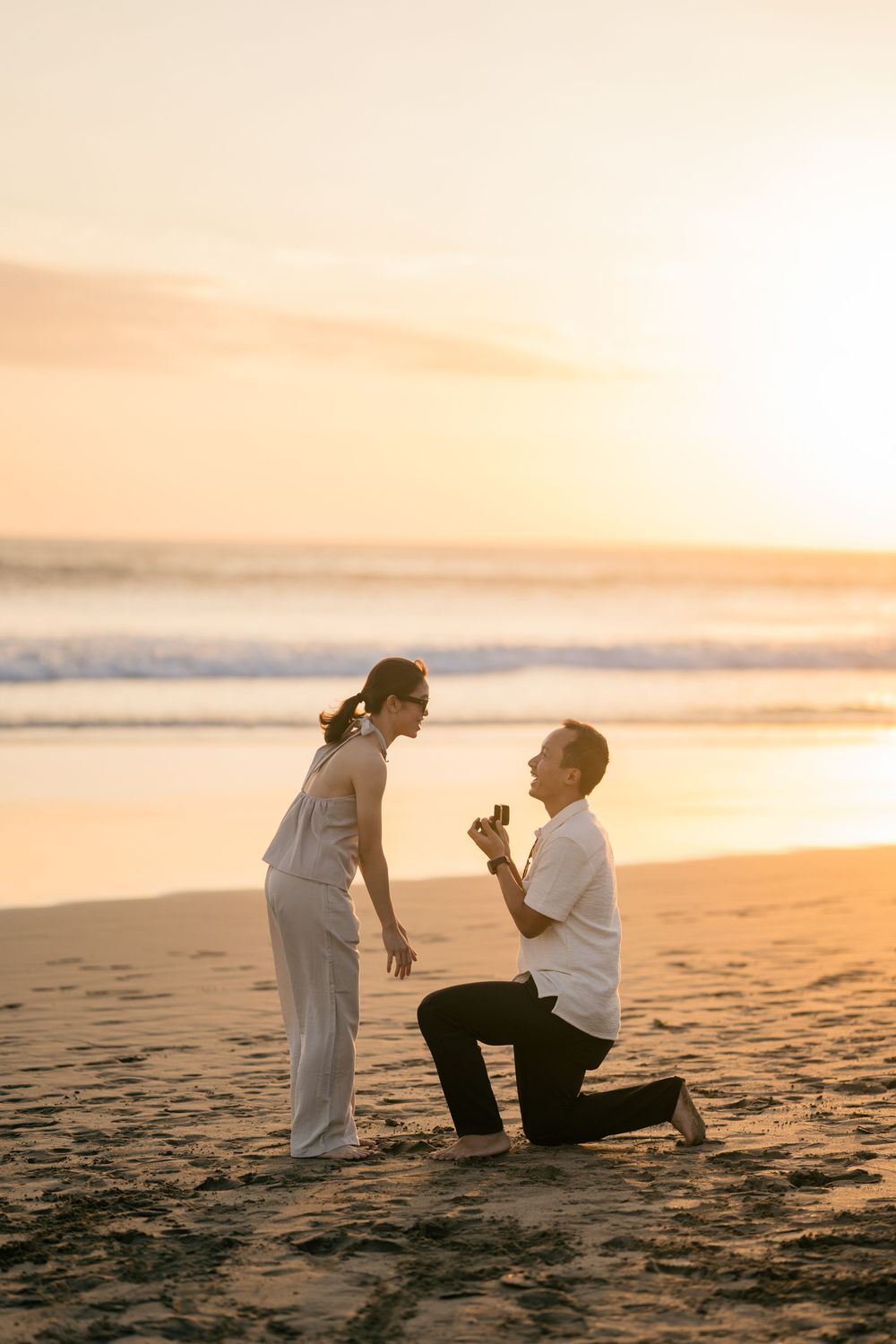 Professional proposal photographer at Petitenget Beach.