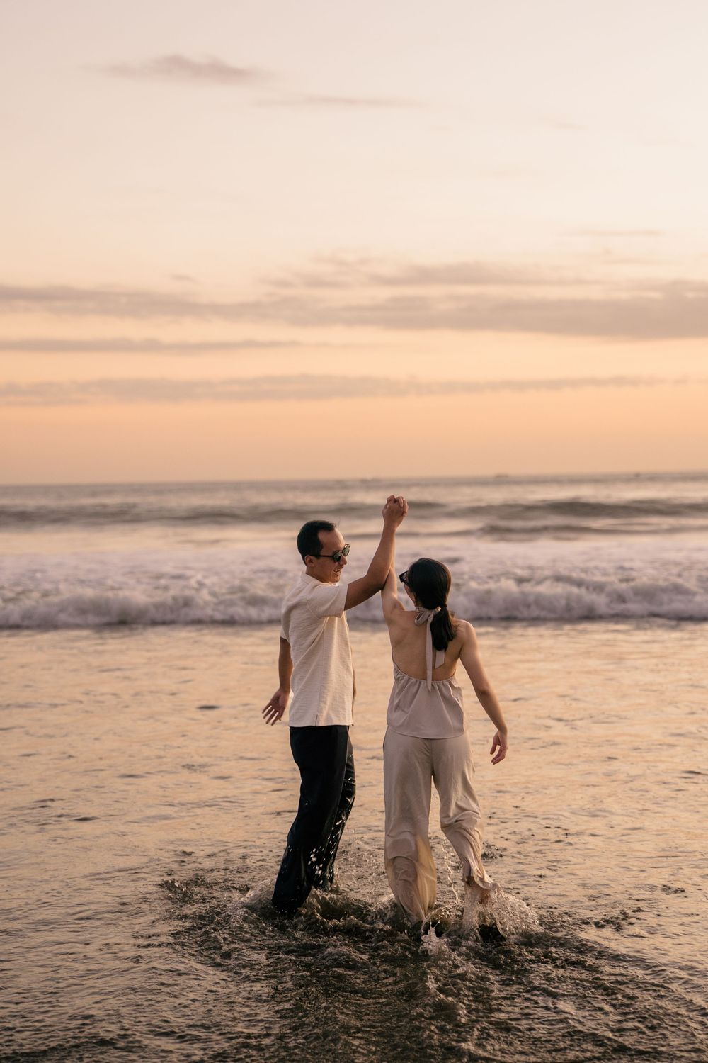 Romantic proposal captured during sunset at Petitenget Beach.