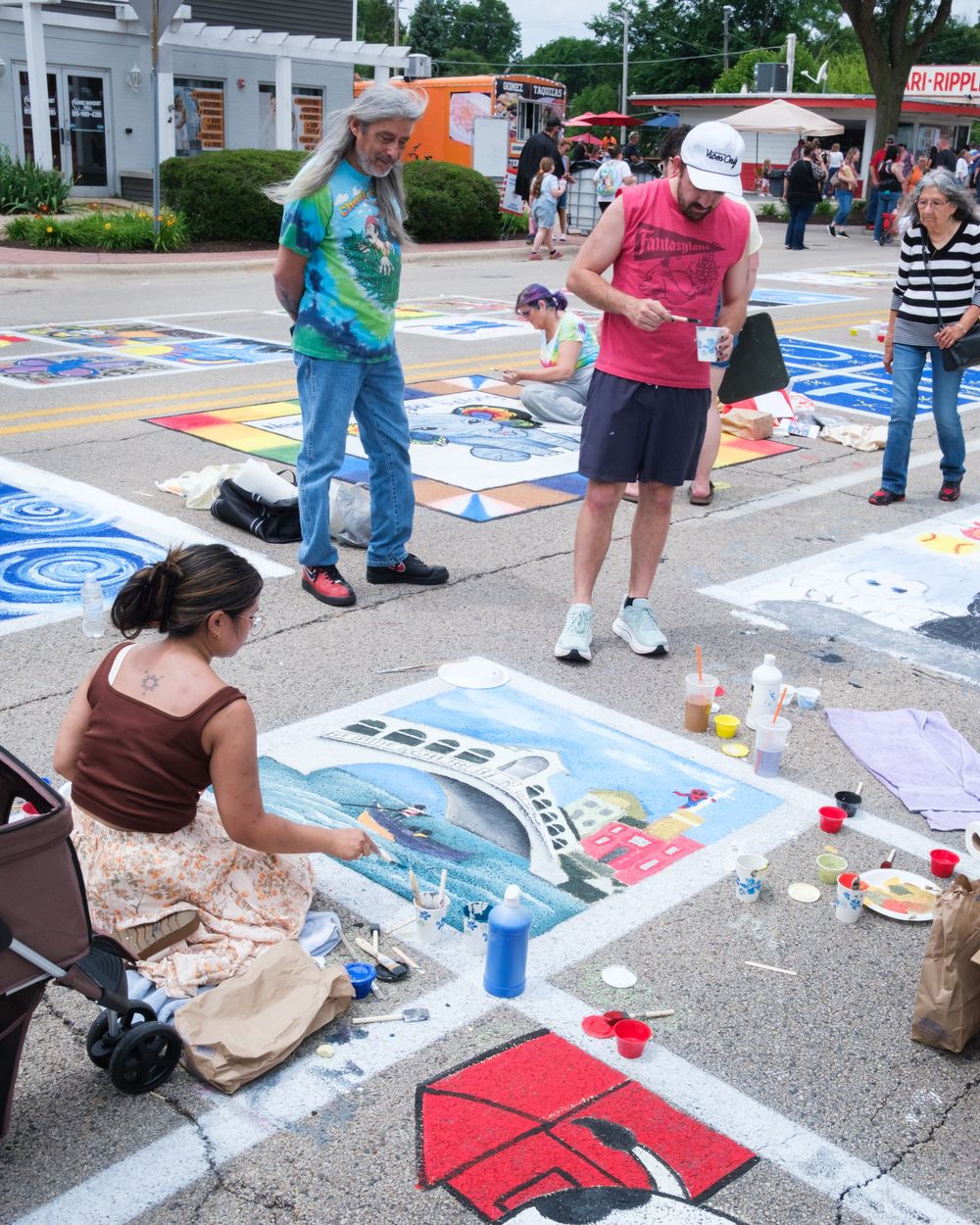 Attendees of Belvidere Heritage Days in Belvidere, IL participate in Paint On State in the downtown area. Saturday, June 27, 2026.