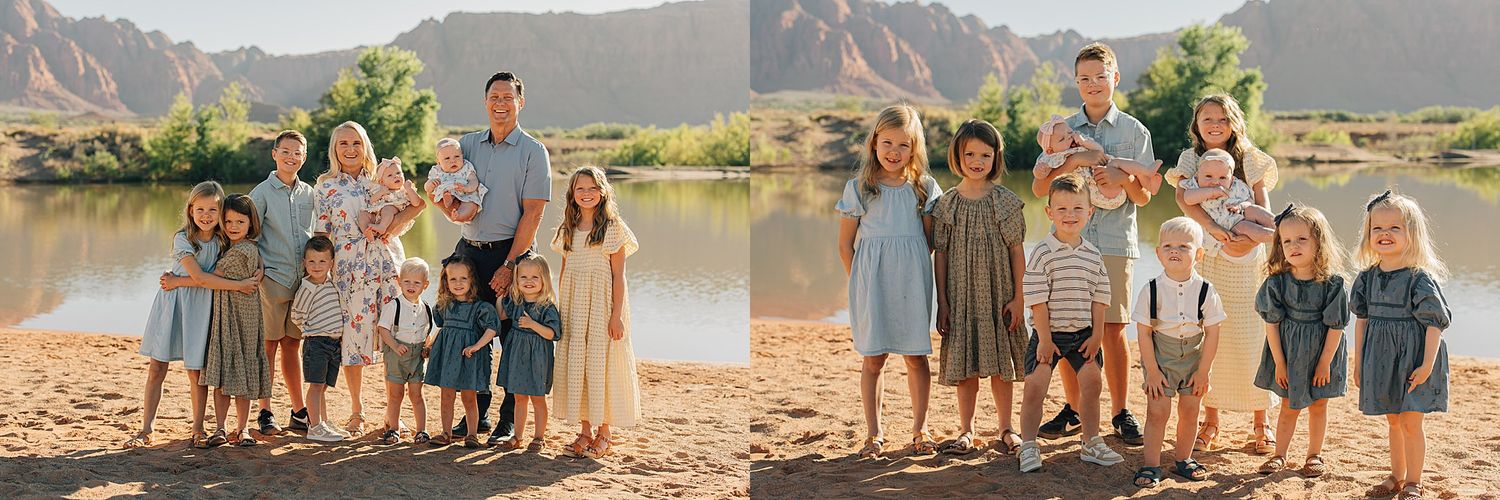 Large family posing by a river with red rock mountains, children in coordinating blue and white outfits during outdoor photo session.