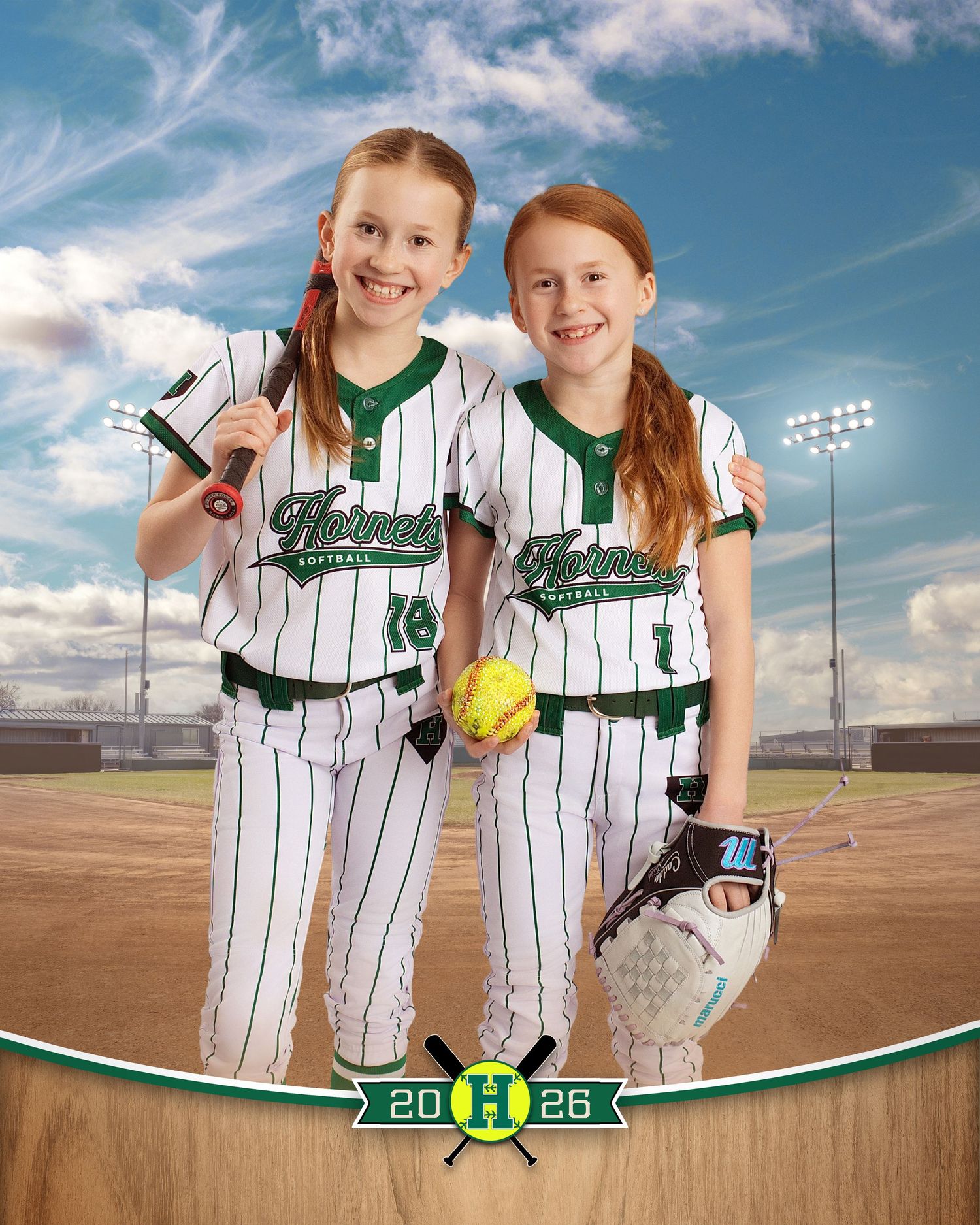 Three kids in green and white baseball uniforms pose with a bat and glove on a baseball field backdrop, dated 2026.