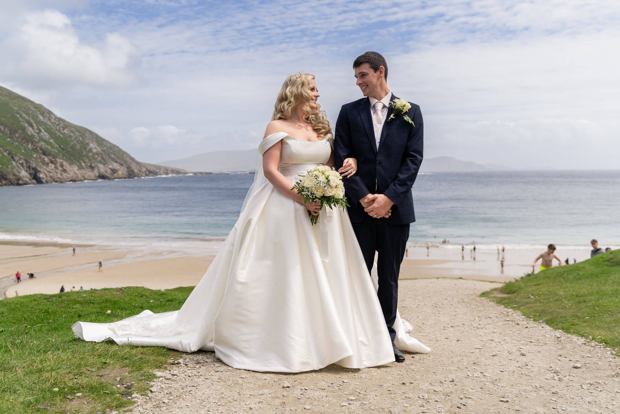 Bride and Groom posing at the beach , Achill Island Co Mayo photo by AK wedding photography and videography.
