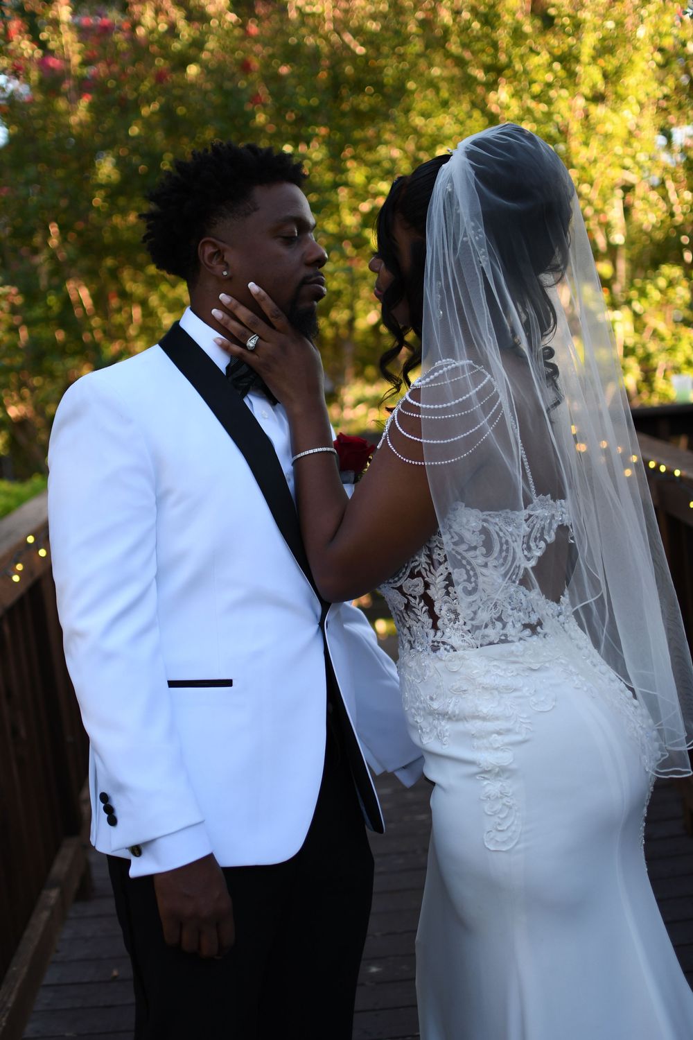 Bride and groom sharing a romantic moment during their outdoor wedding