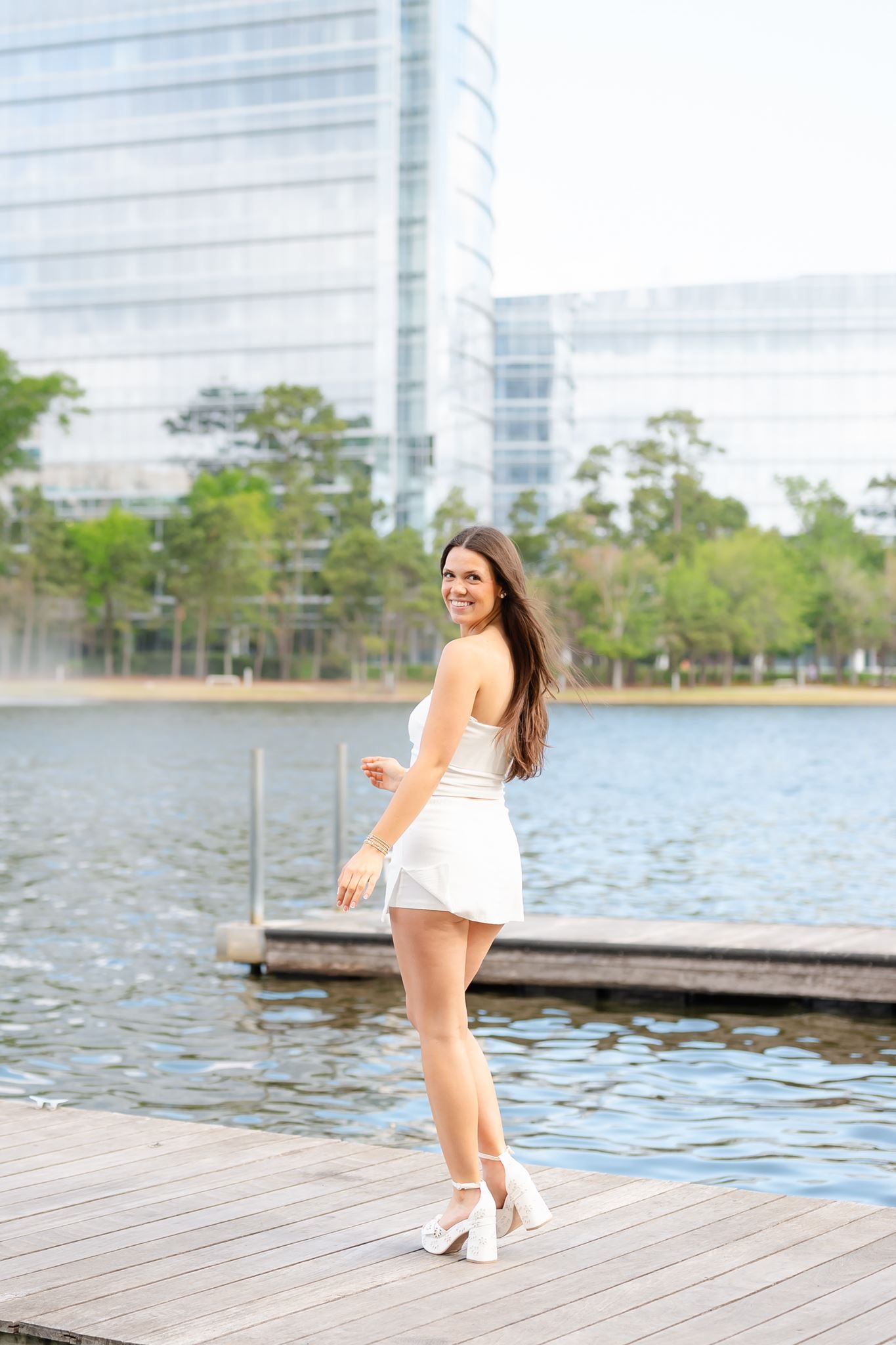 Klein Oak High School senior girl posing on a boat dock in The Woodlands Texas