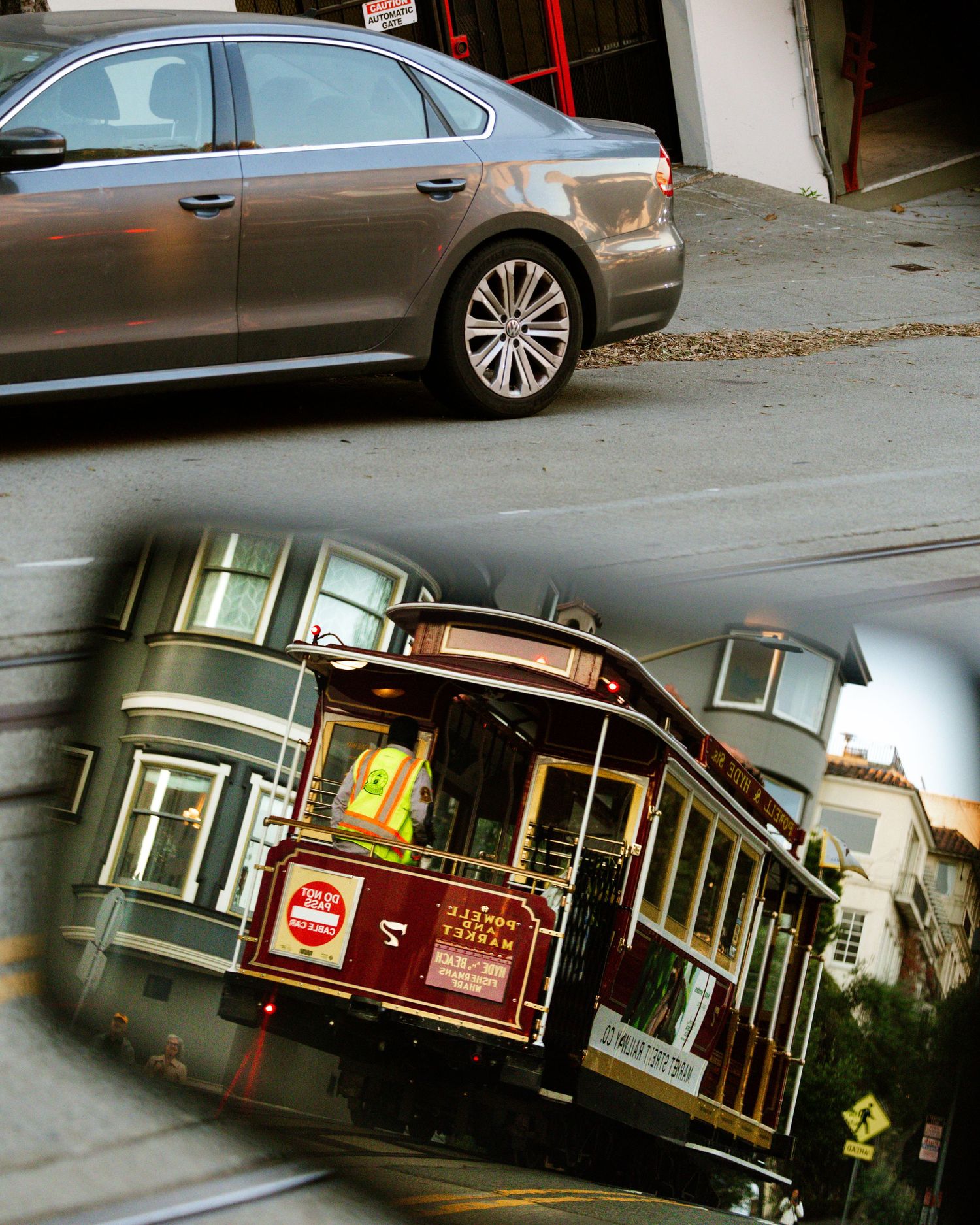 A silver sedan parked near a garage beside a San Francisco cable car on a steep hill street.