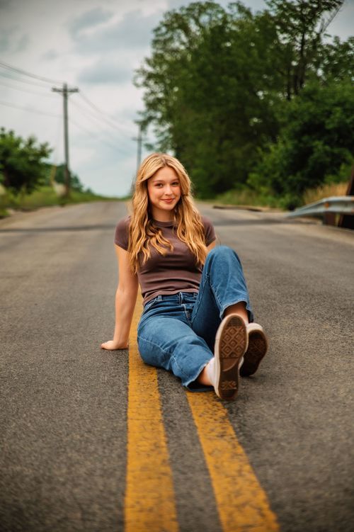 High school senior posing outdoors during a senior photography session in St. Marys, Ohio