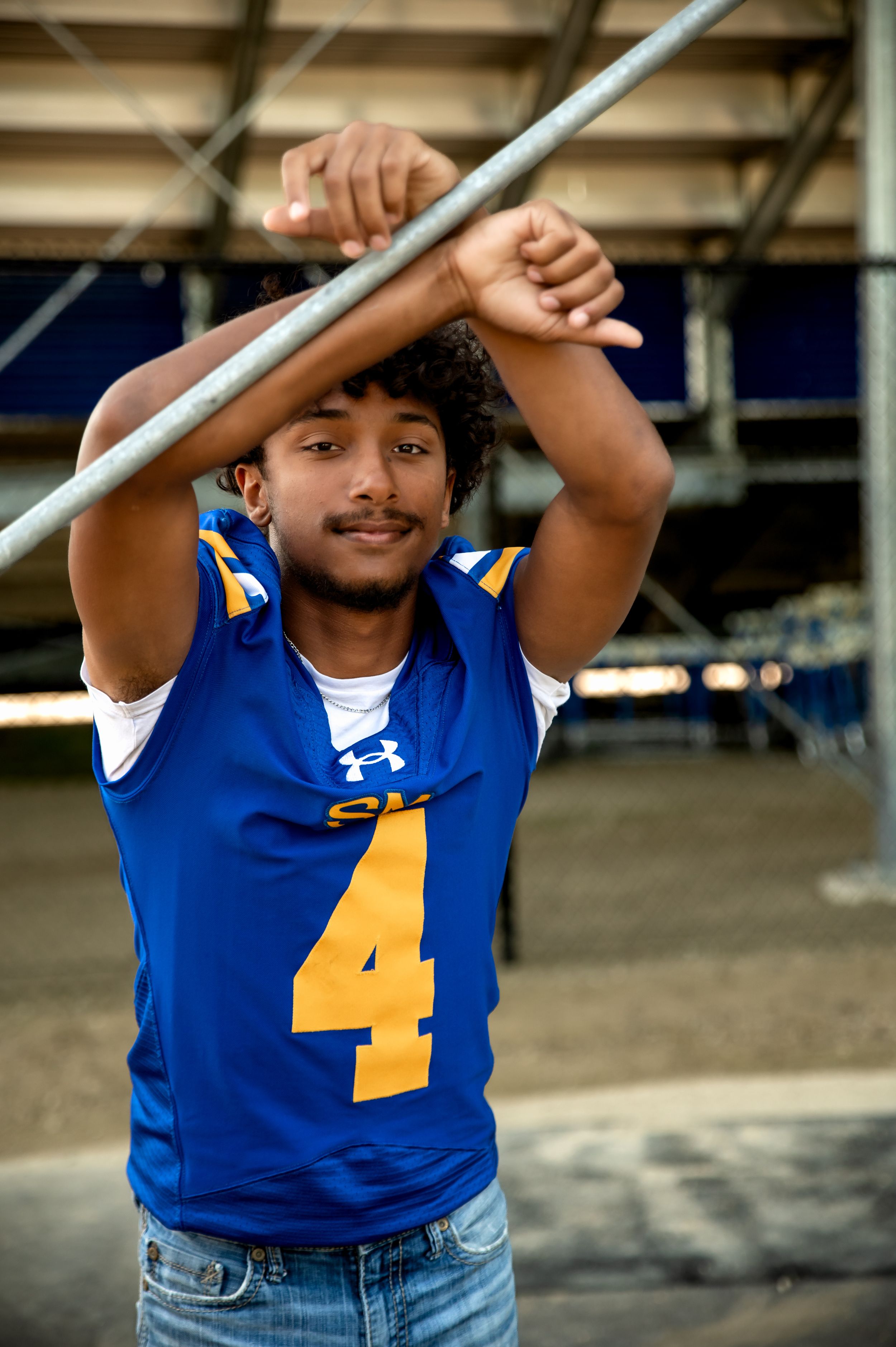High school senior posing outdoors during a senior photography session in St. Marys, Ohio