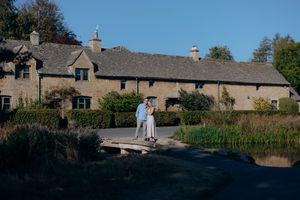 Couple celebrating their engagement in Lower Slaughter.