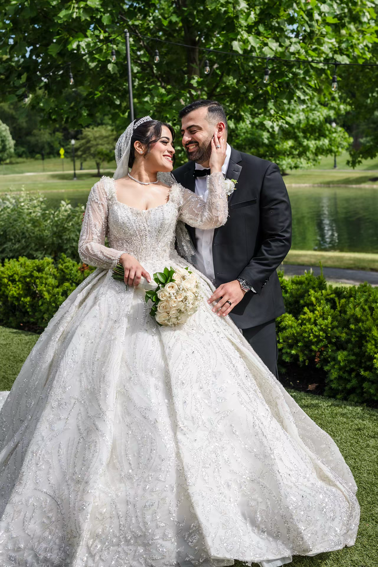 A bride in a white intimate moment photo by sassi photo at renaissance outdoor wedding venue.