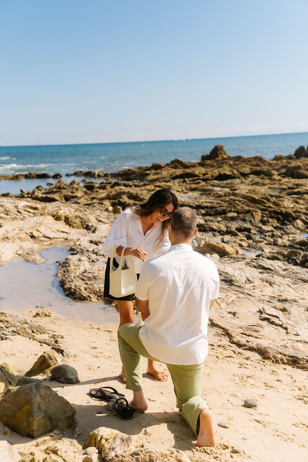getting down on one knee to pop the question! what a beautiful proposal.