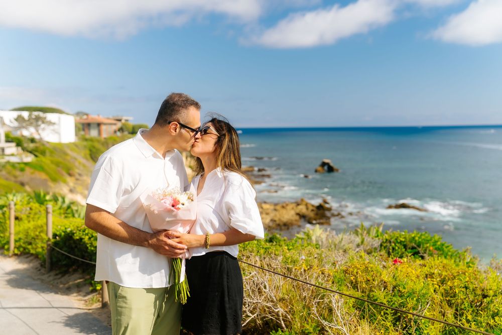 Couple out at the beach for their suprise proposal and engagement!