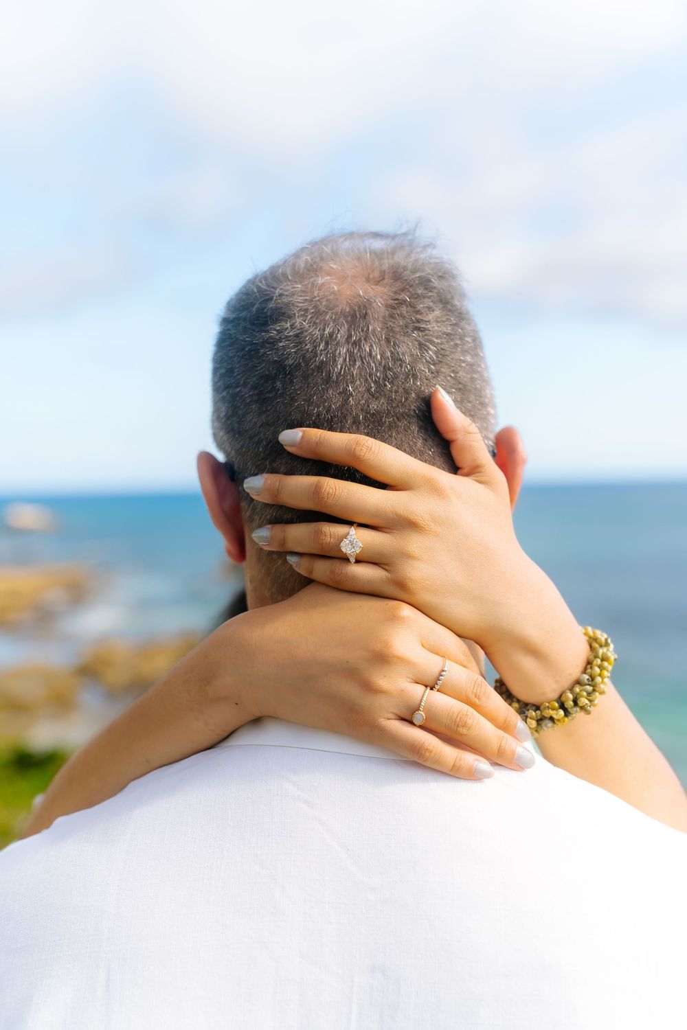 Couple out at the beach for their suprise proposal and engagement!