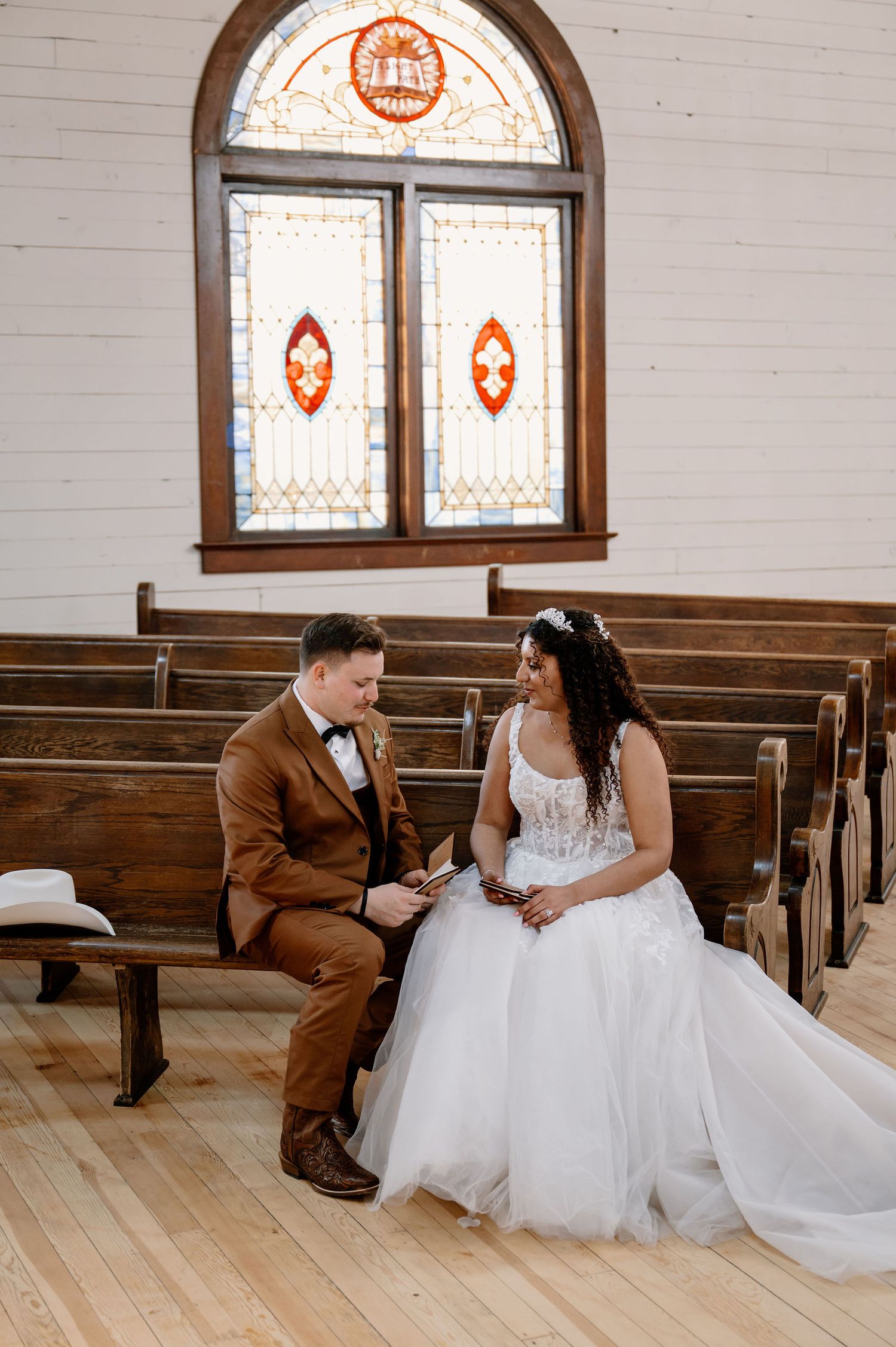 Private vows at The Scotsman in Dayton, WA, with stained glass windows in the background