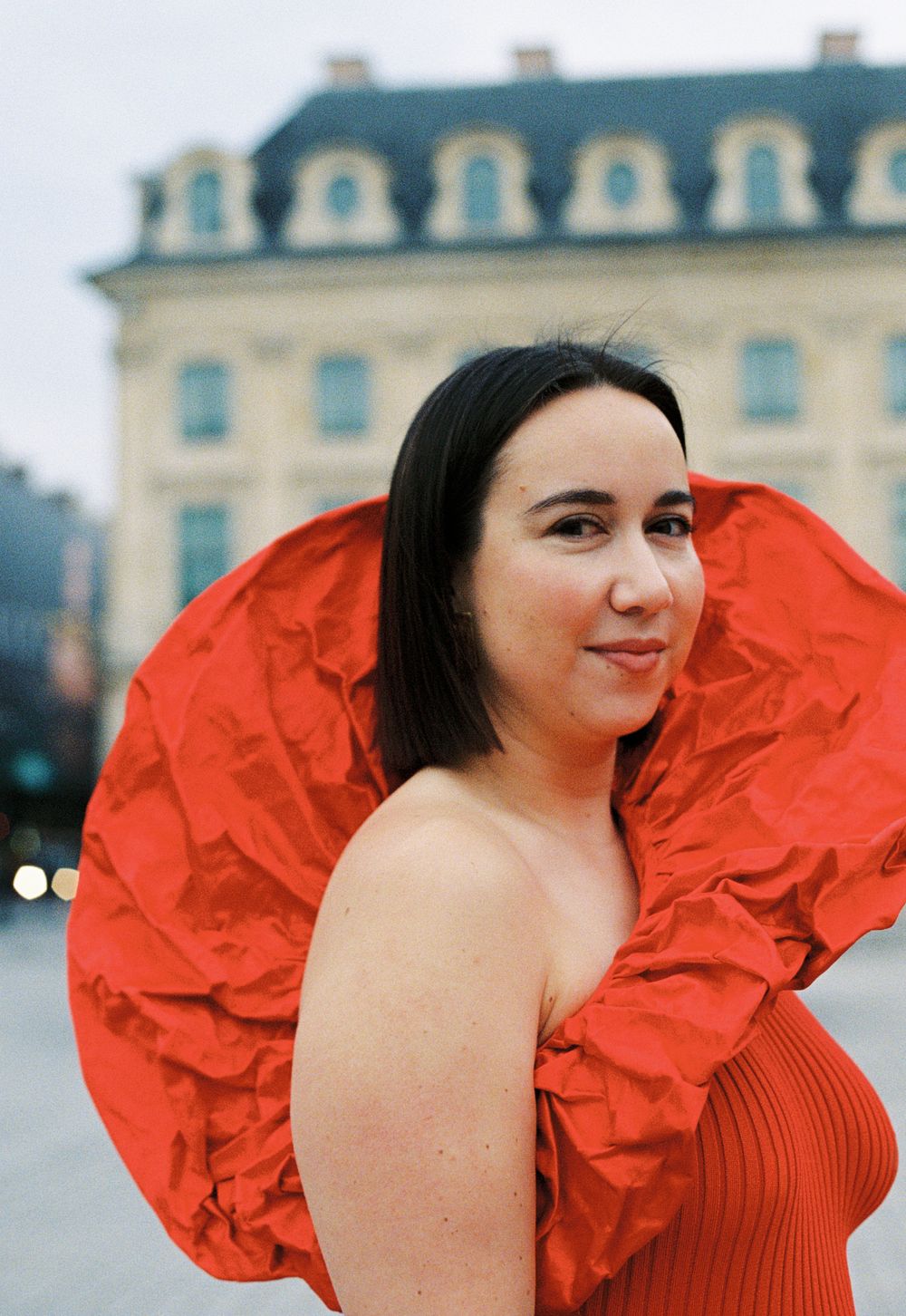 Woman in red ruffled dress Schiaparelli, gina knox photoshoot, paris fashion photographer, paris film photographer, pfw photographer