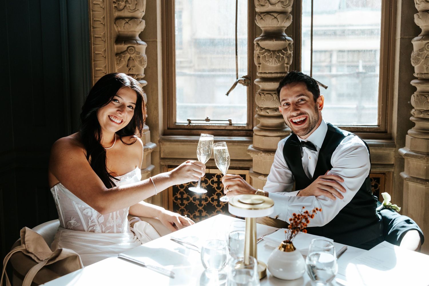 fun couple having a private dinner at beacon grand hotel during san francisco elopement day