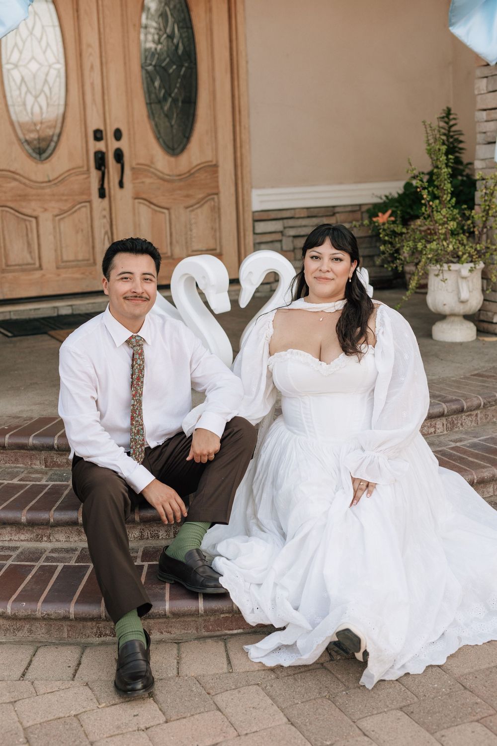 Bride and groom with swan wedding details, photographed on film by retro film photographer in Los Angeles.