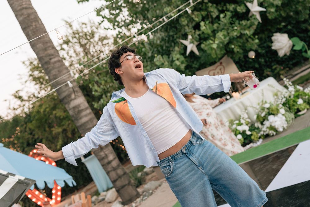 Film photo of guests dancing at backyard wedding reception in Los Angeles California.