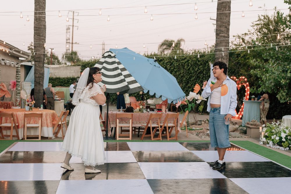 Film wedding photographer captures bride dancing with her friends at lively backyard wedding near Highland Park, Los Angeles, California.