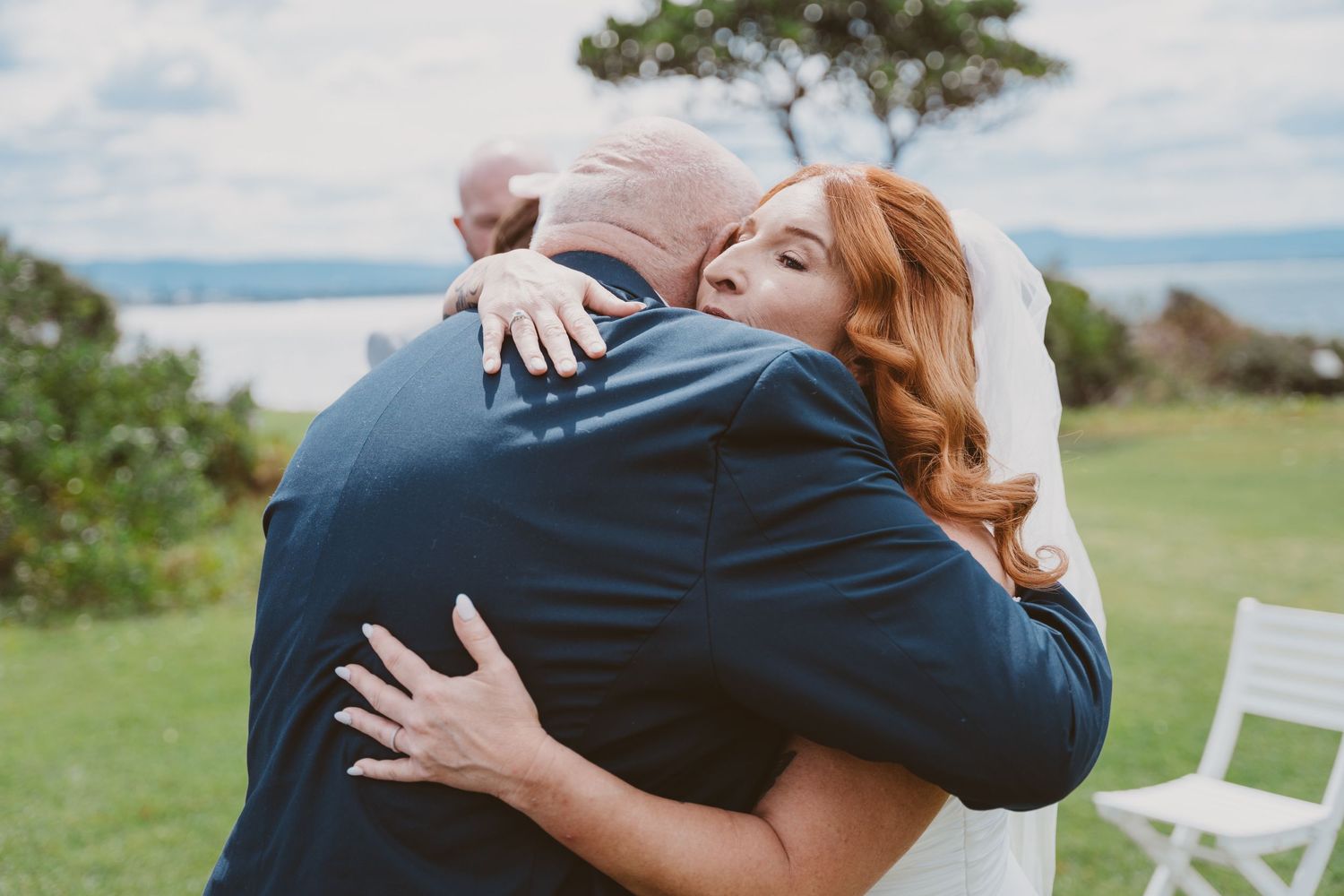 Bride hugs a loved one after the ceremony - emotional moments at an intimate elopement