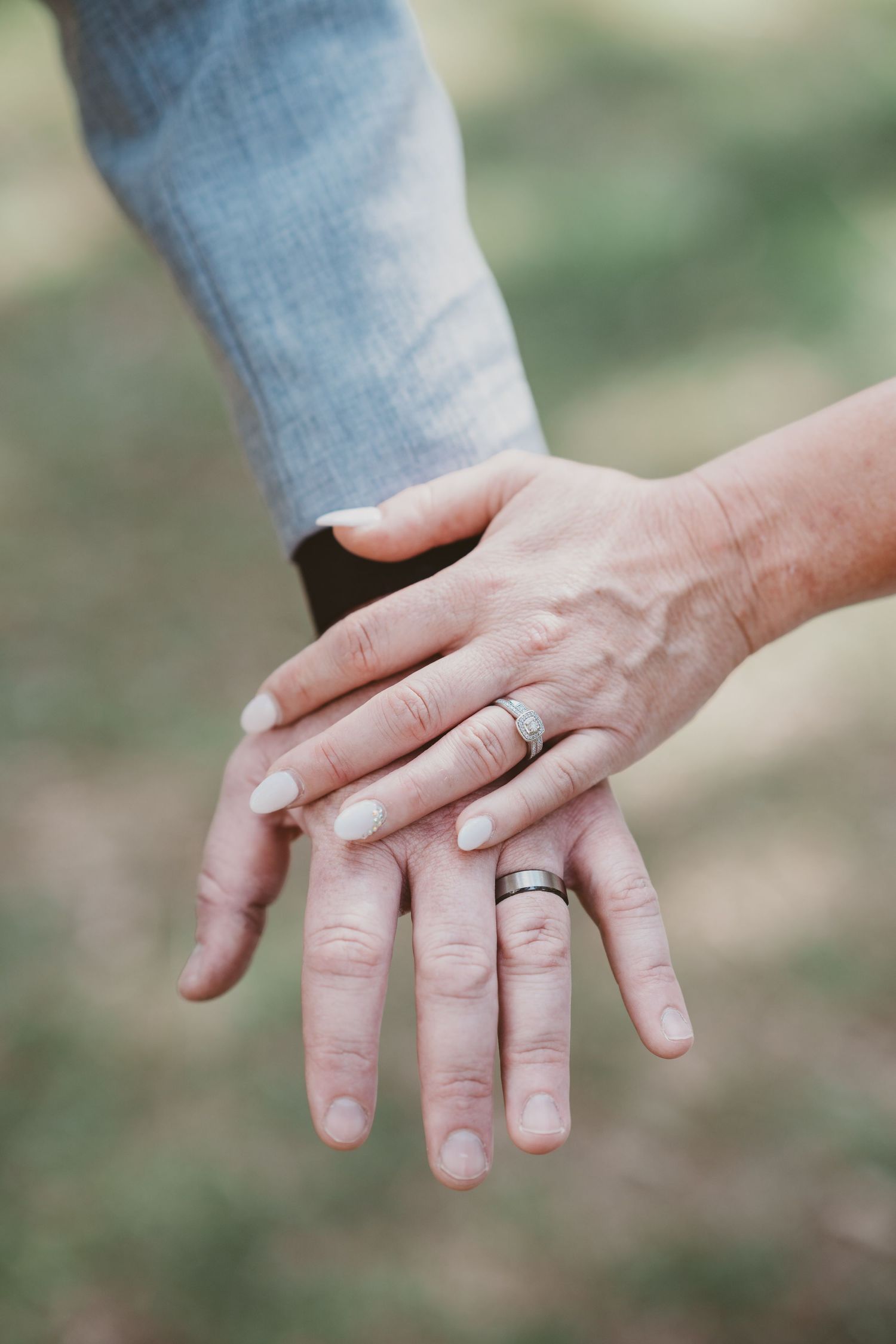 Close-up of hands showing wedding rings - elopement detail photography by Purple Bird Photo