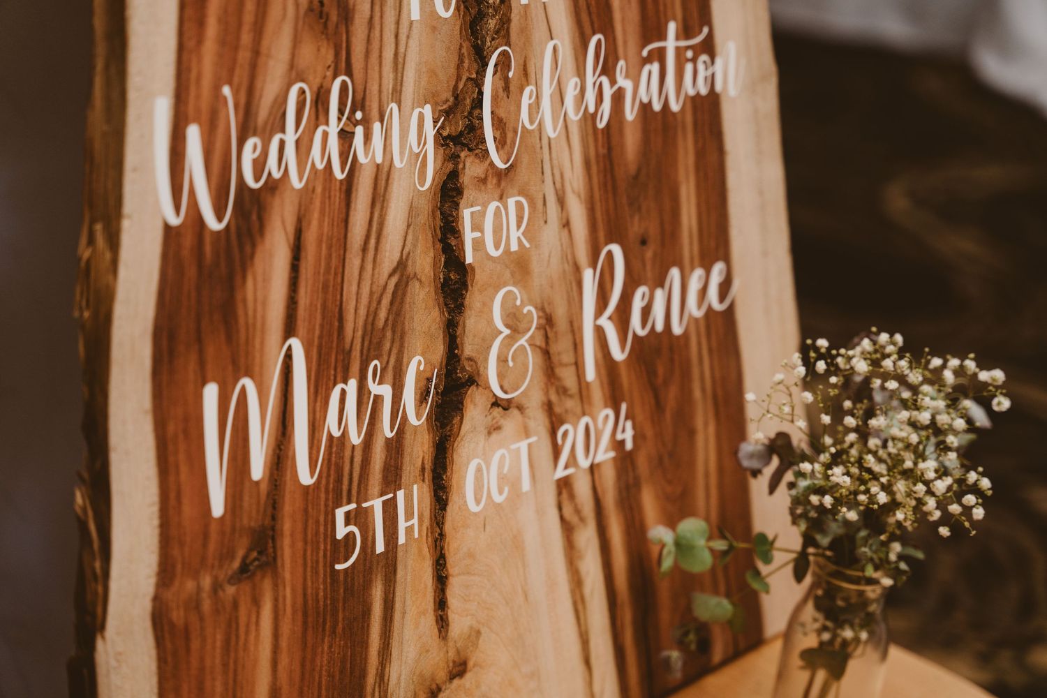 Wedding celebration sign for Marc and Renee on timber - elopement reception detail