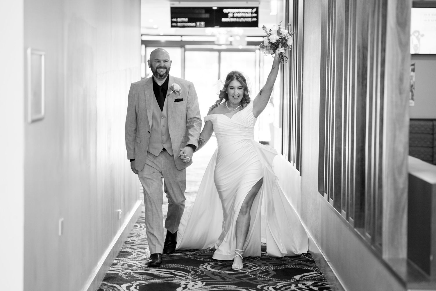 Black and white grand entrance of the newlyweds at their celebration - small elopement reception photos