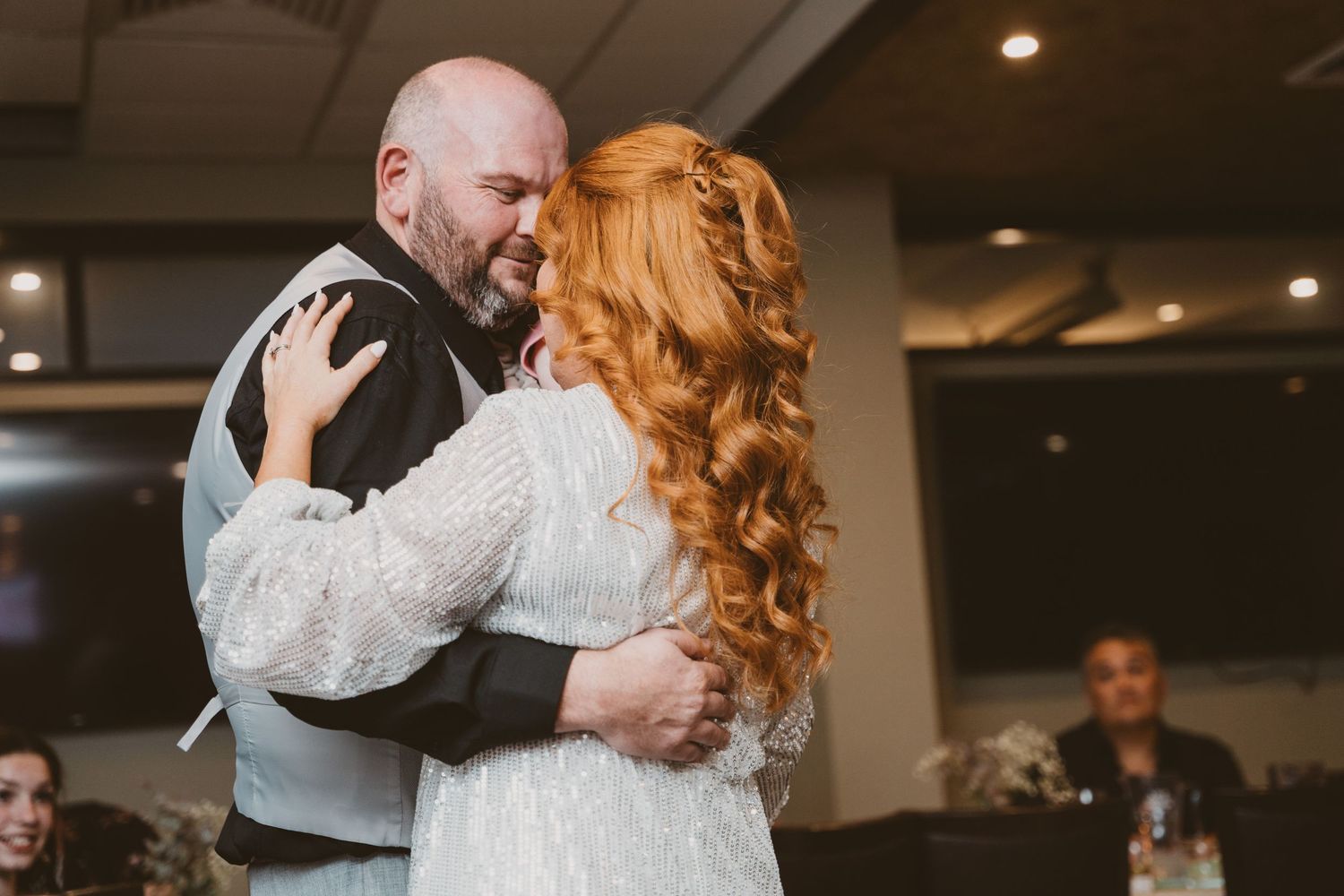 Newlyweds share their first dance at an intimate reception - elopement celebration photography