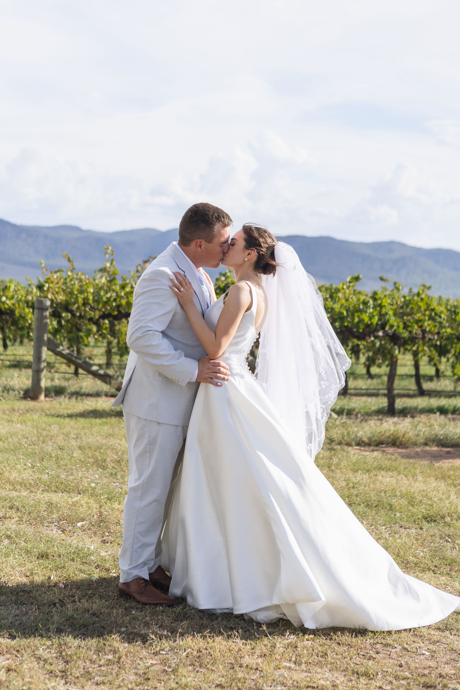 Bride and groom kissing at Two Rivers Winery Wedding in Denman