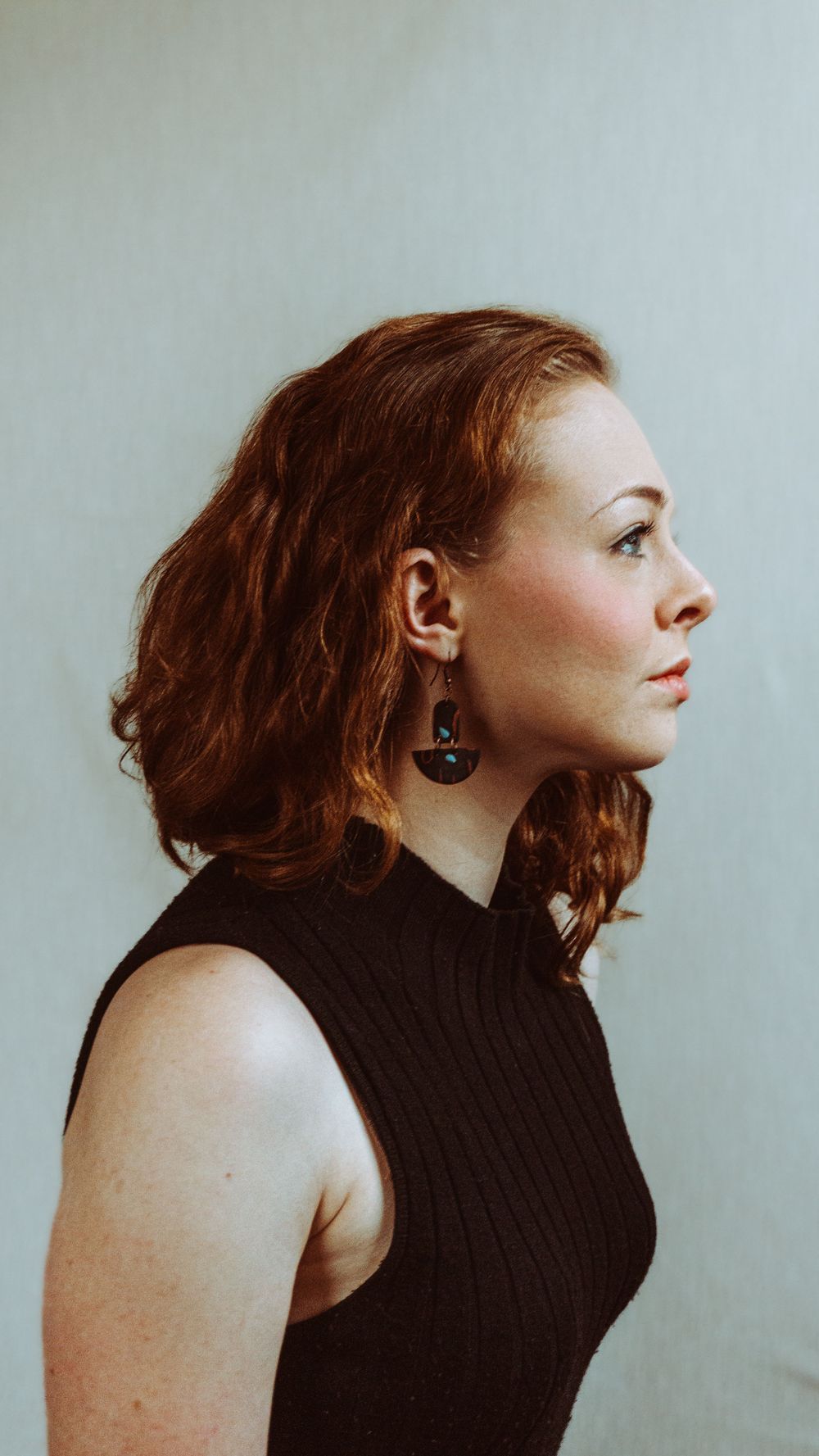 Artistic portrait sequence showing profile poses against a light gray background.