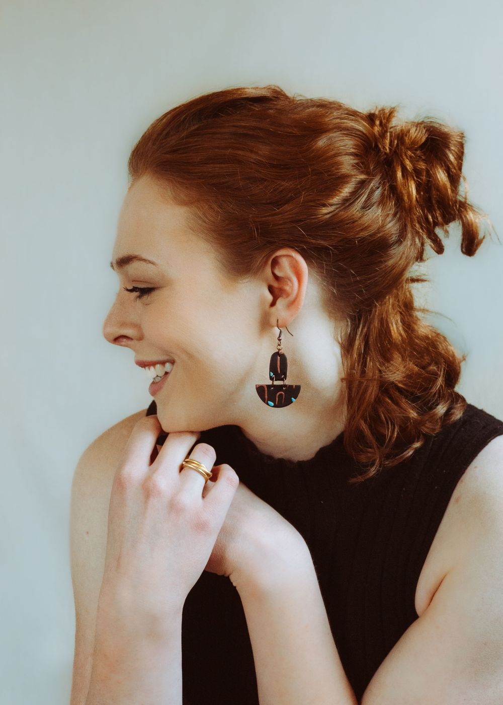 Dynamic portrait sequence showing laughter and natural expressions in studio lighting.