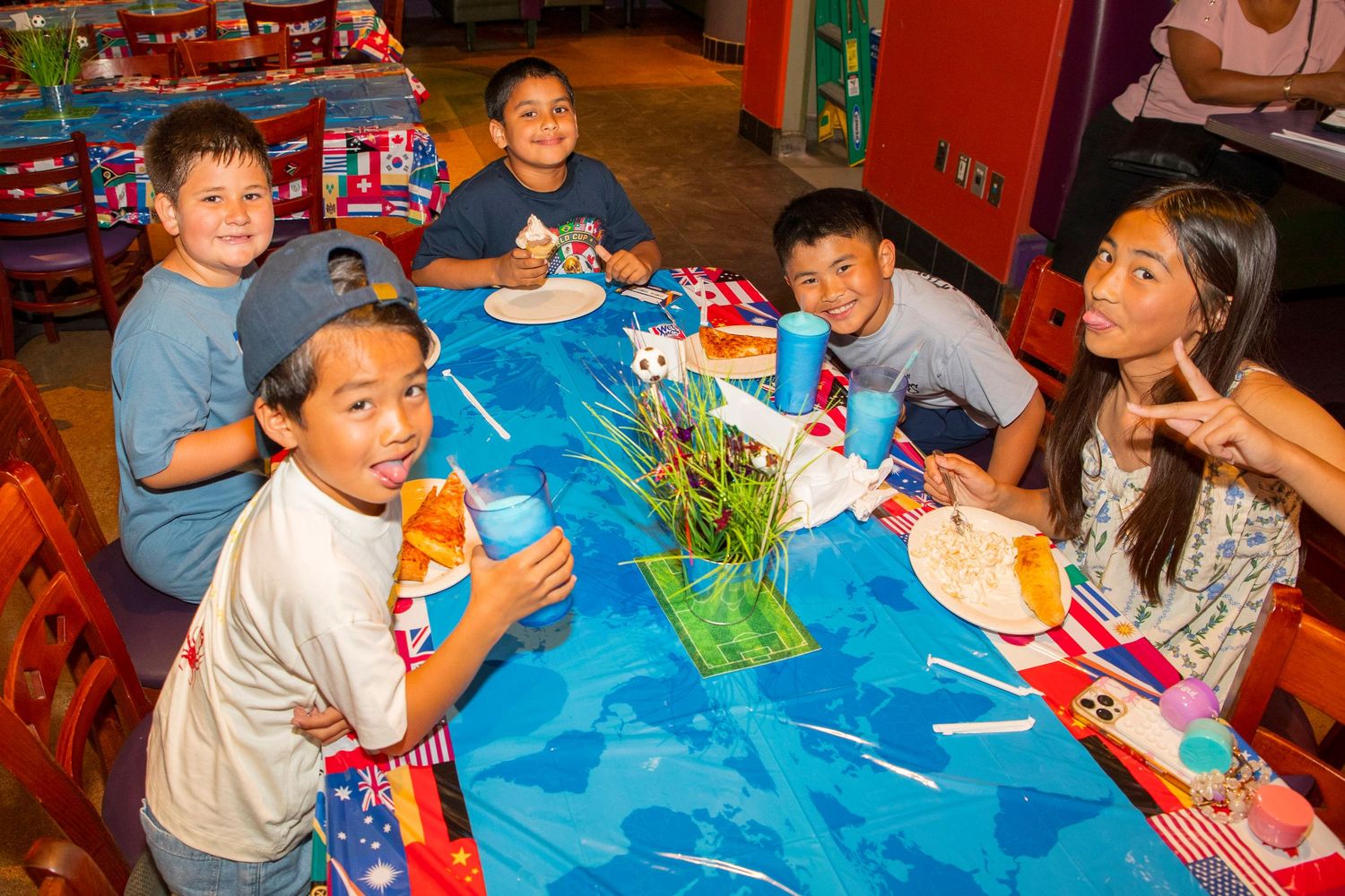 Kids party photography Los Angeles blowing out candles