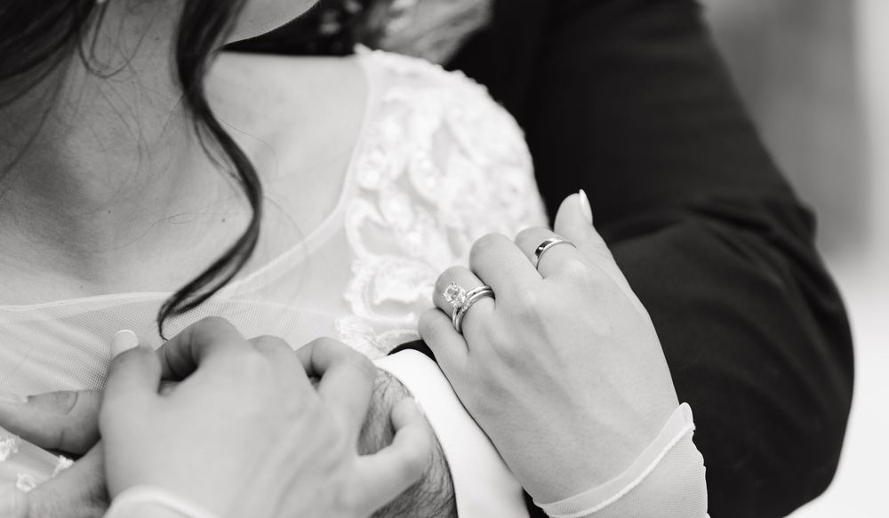 A romantic black and white wedding montage showing intimate moments between newlyweds during their special day.