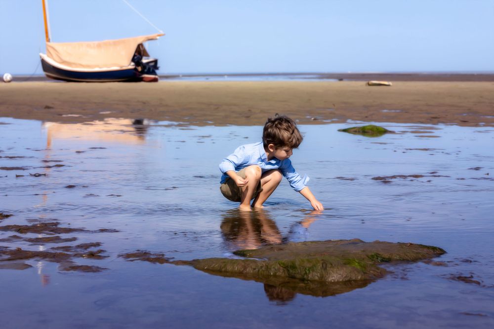 boy playing on the beach cape cod ma