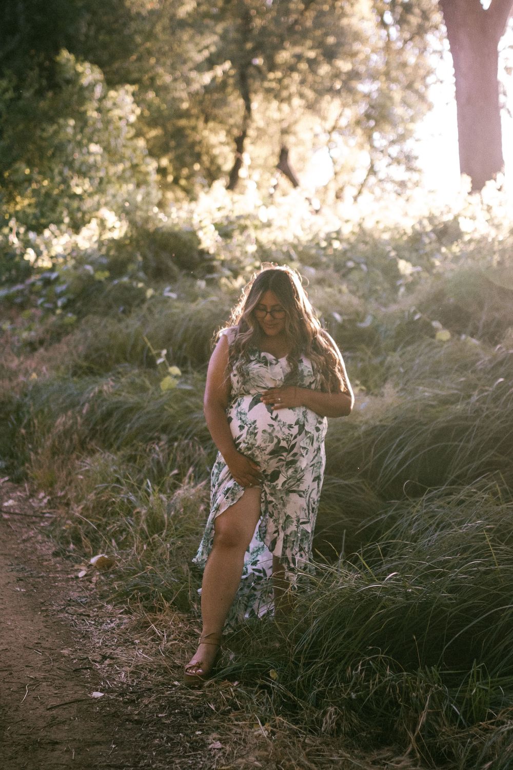 A sequence of dreamy golden-hour photos showing someone in a floral dress walking through tall swaying grass.