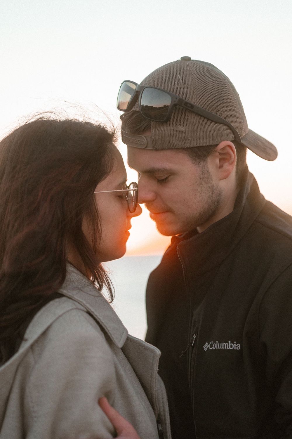 Intimate close-up portrait during golden hour sunset.