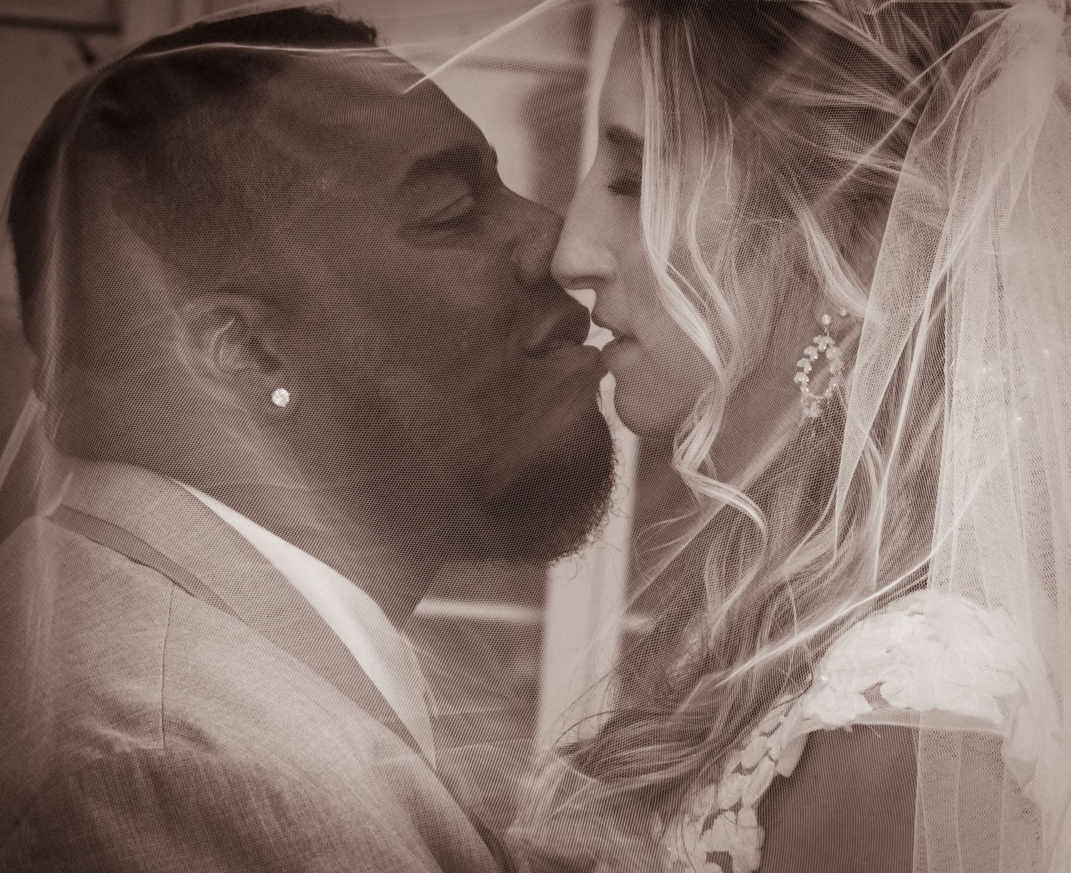 An intimate wedding moment captured in black and white photography.