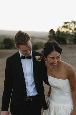 Candid moments of newlyweds laughing together during sunset portraits. Best wedding photographer in Adelaide SA