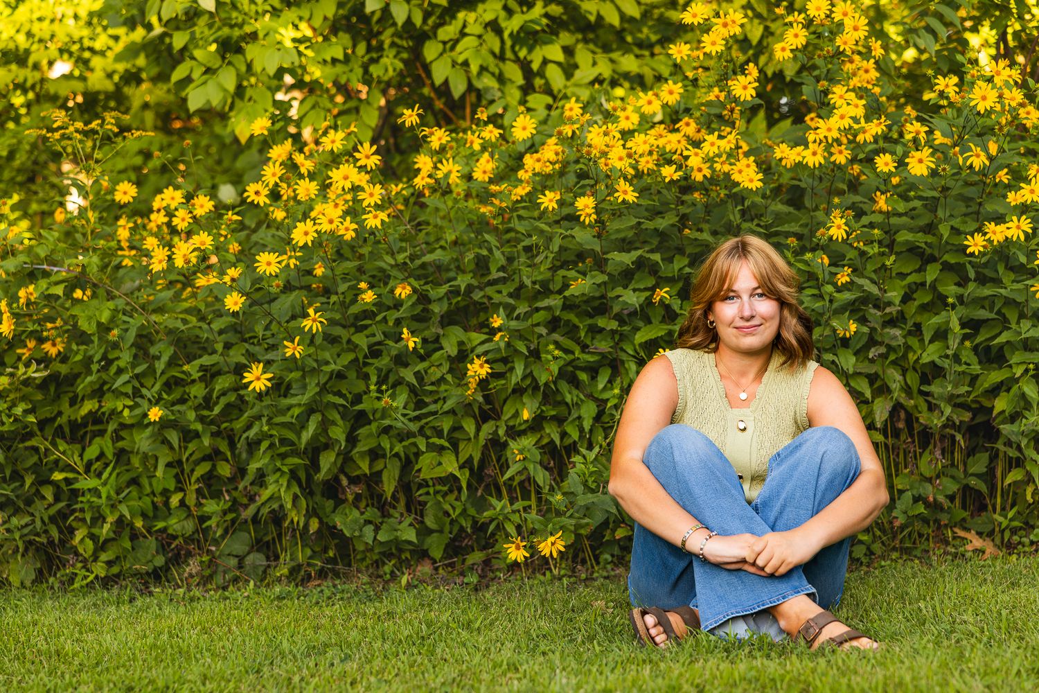 A sequence of outdoor portraits against a vibrant yellow flowering bush in a garden setting.