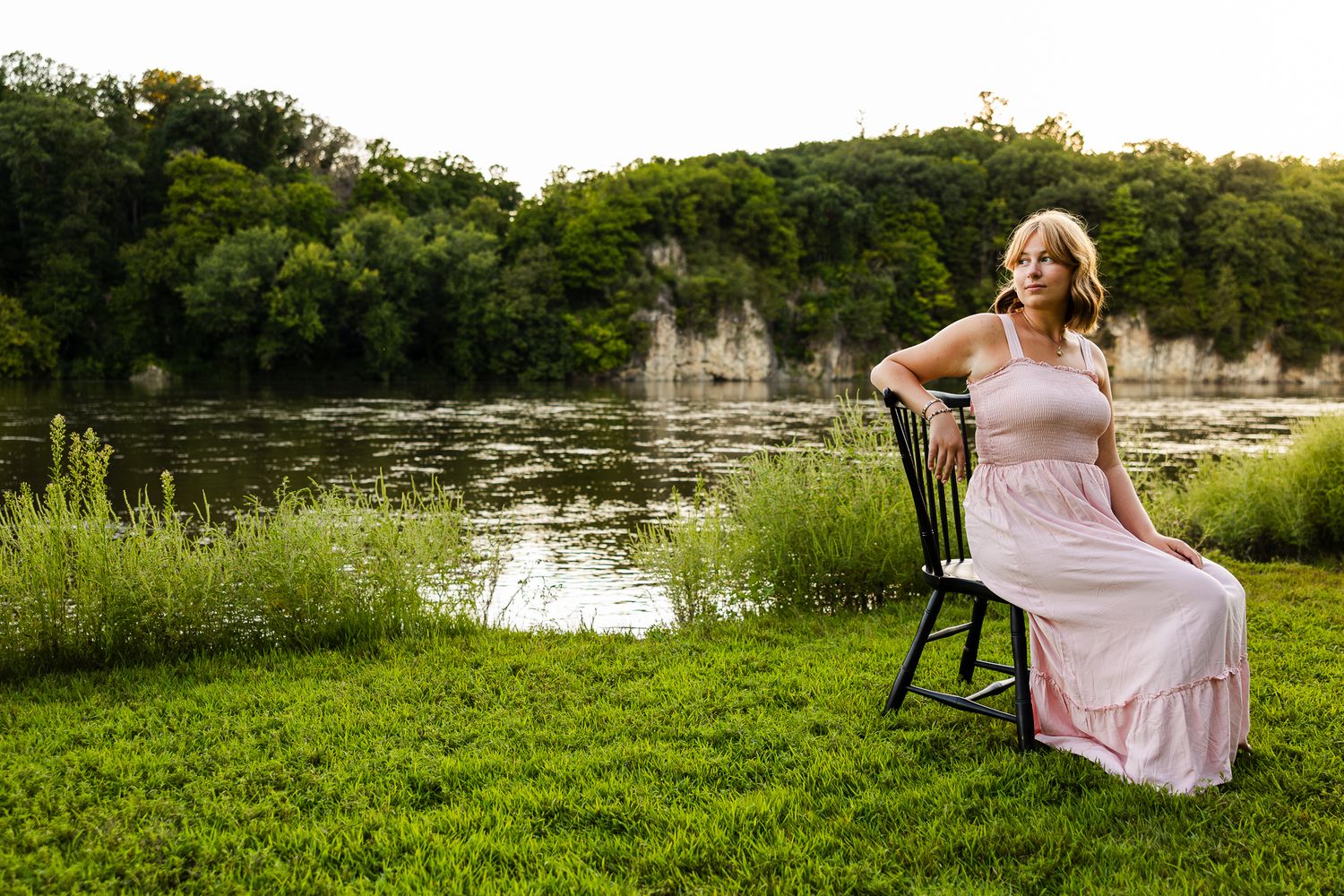 Series of outdoor portraits taken near a serene pond with lush greenery and natural lighting.