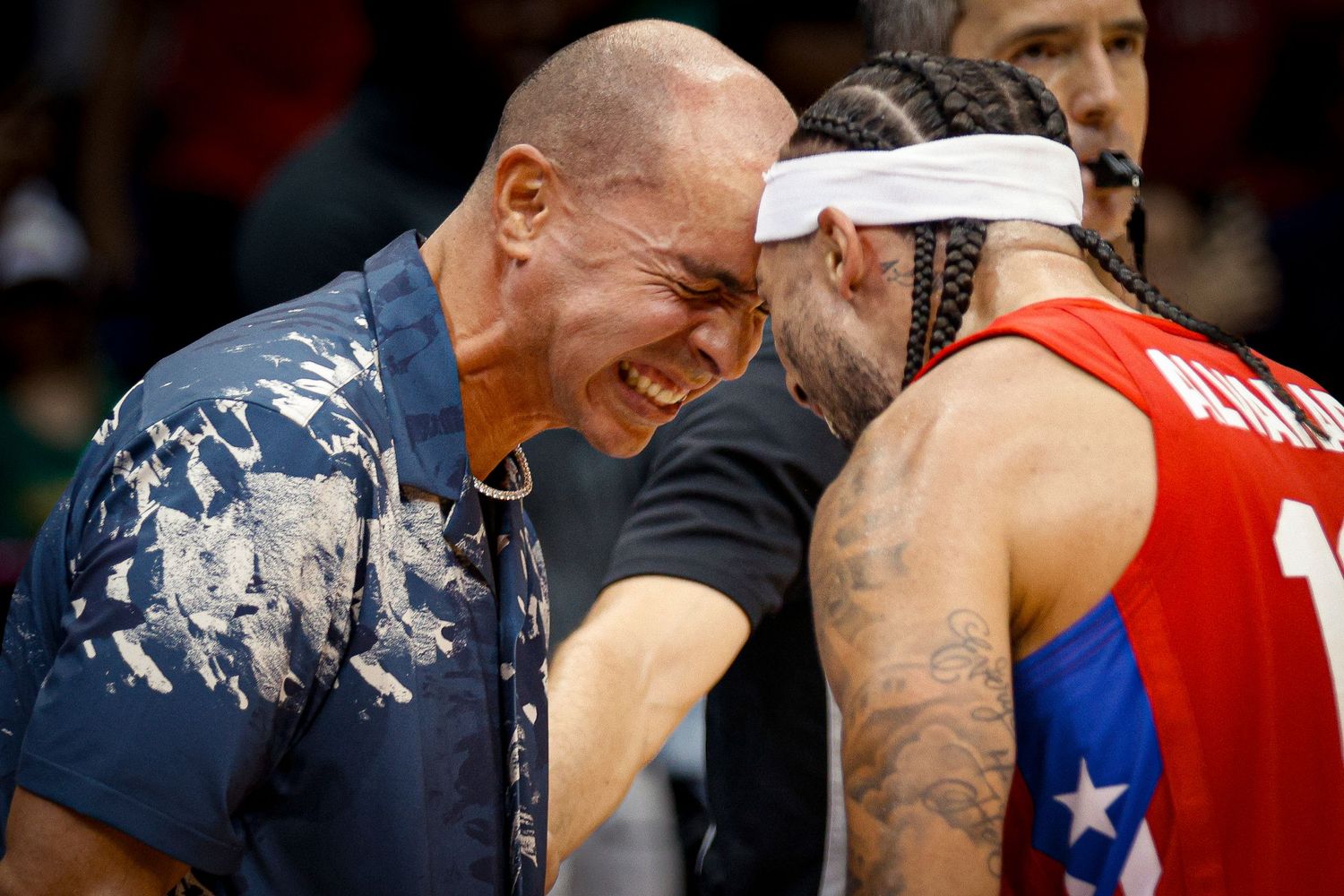 José Alvarado and the general manager of Puerto Rico, Carlos Arroyo, celebrate qualifying for the Olympic Games in Paris