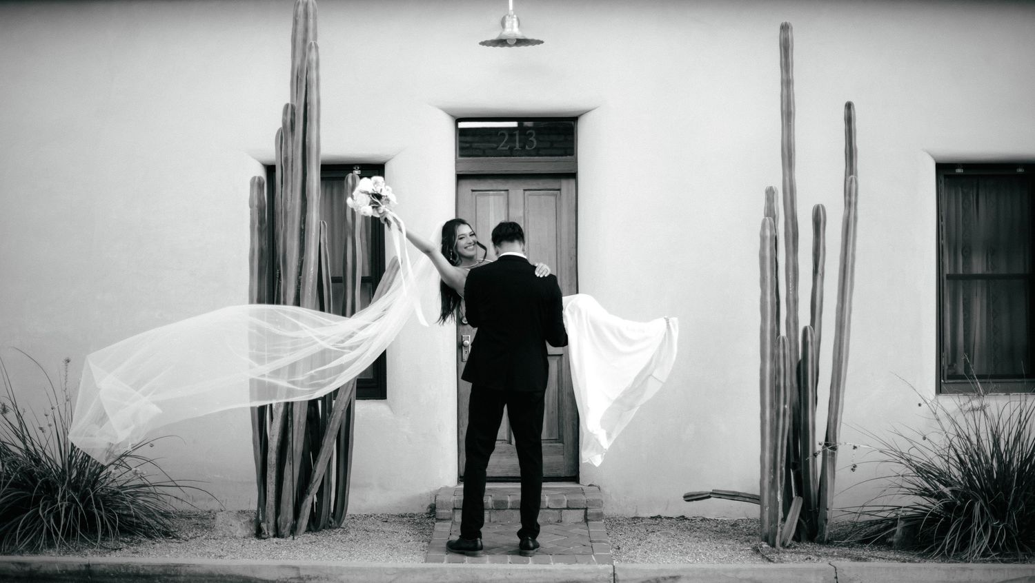 Black and white wedding photos showing a couple against a white wall with dramatic shadows.