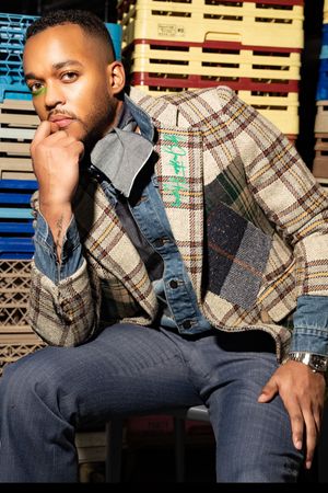 A person wearing a plaid jacket and jeans poses against a striped background in a series of fashion shots.