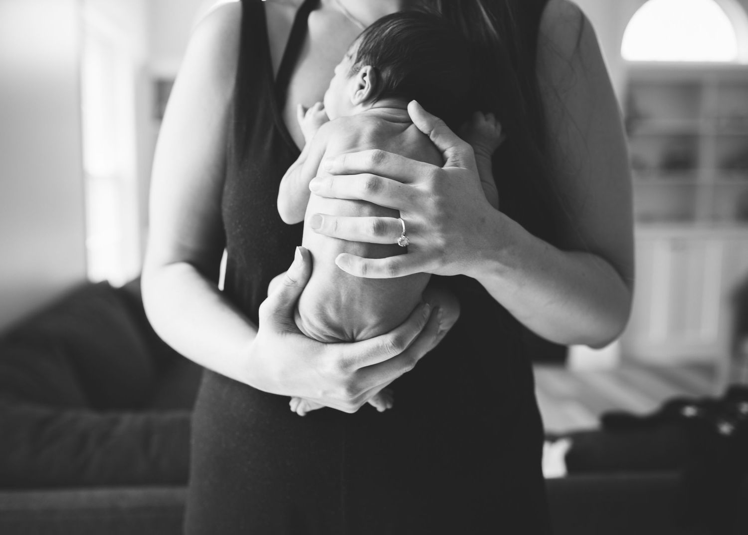 Black and White Newborn baby cuddles
