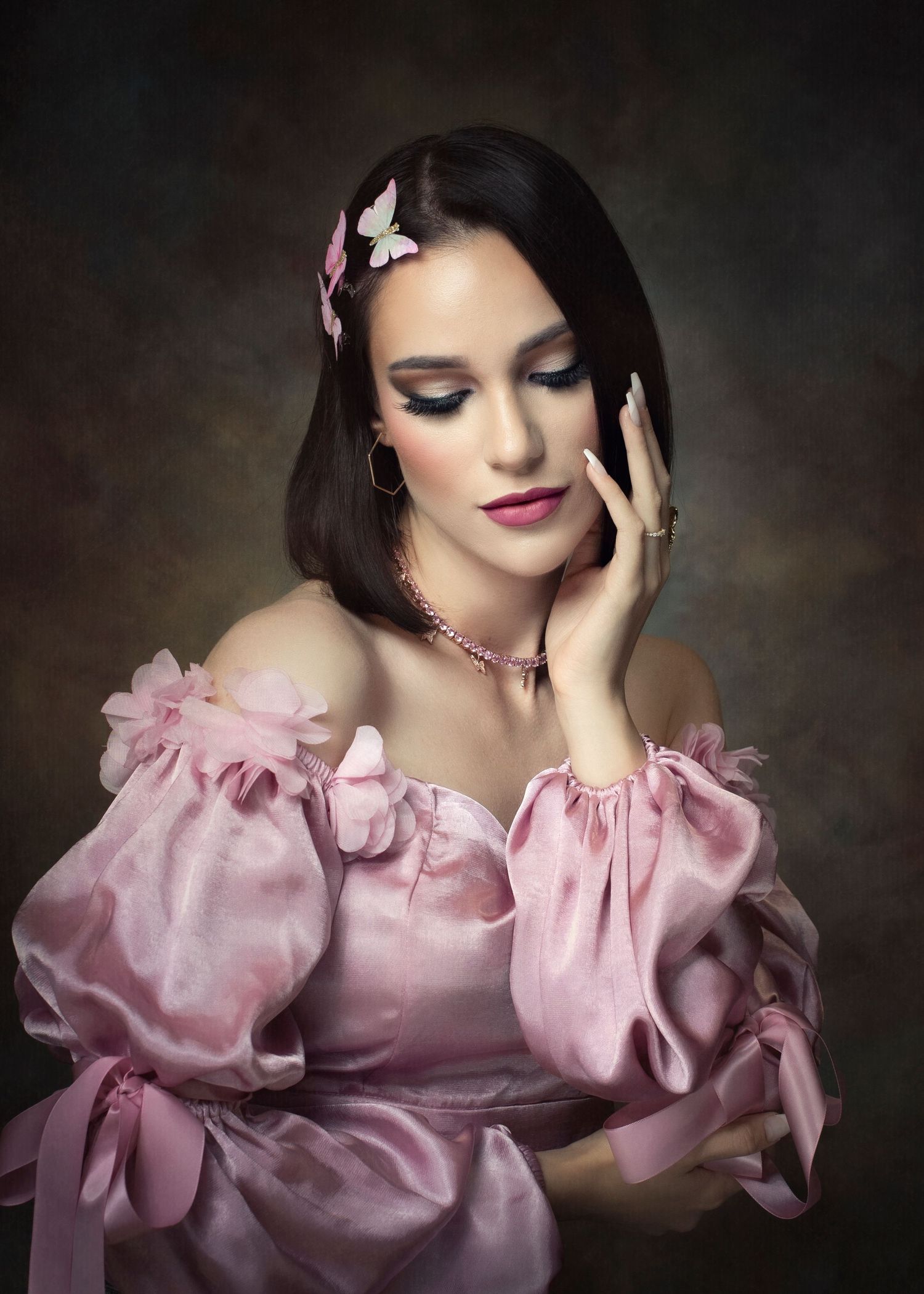Romantic portrait in pink puff sleeve dress with vintage glamour styling.