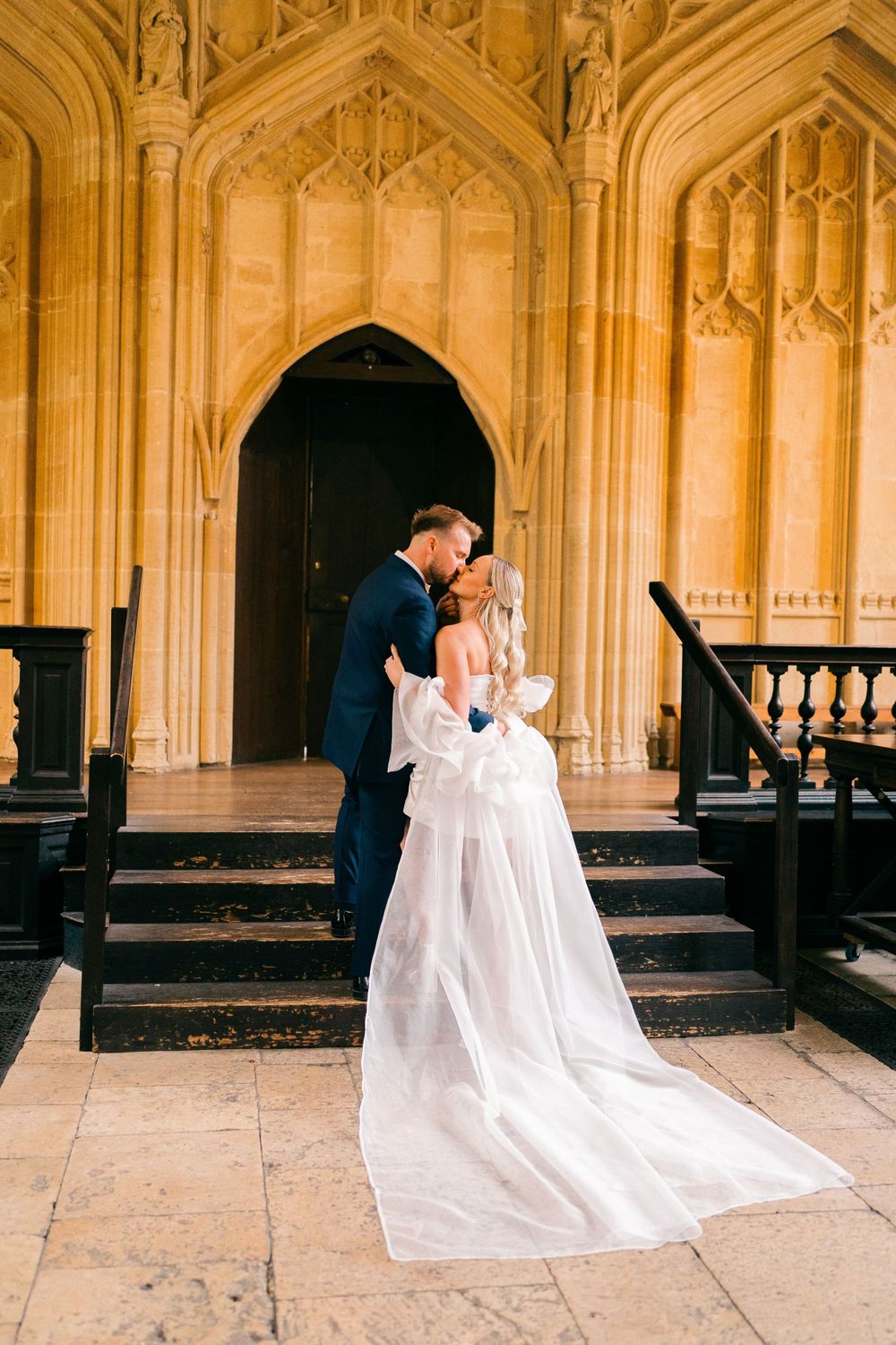 Wedding photo sequence in Gothic cathedral showing flowing white dress against architectural columns.