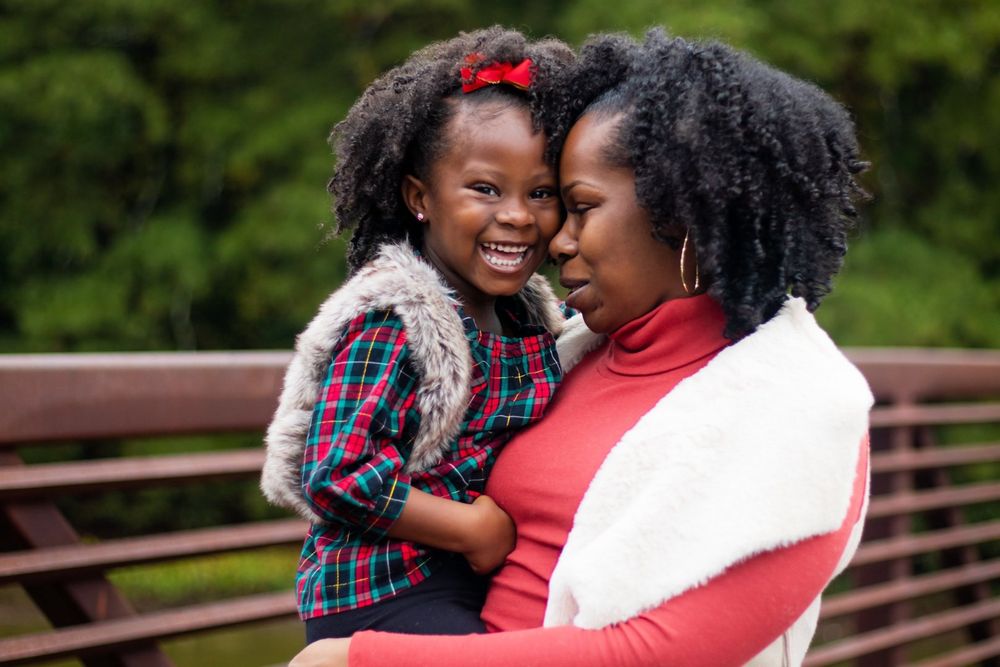 mom and daughter portrait on a bridge in downtown Acworth