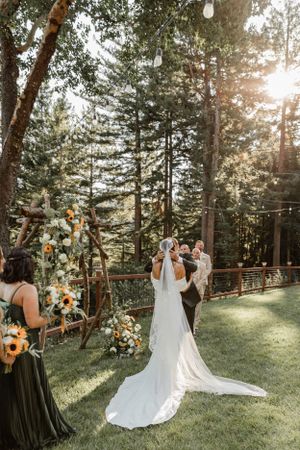 Bride and groom kiss after exchanging vows in the Santa Cruz Mountains of California.