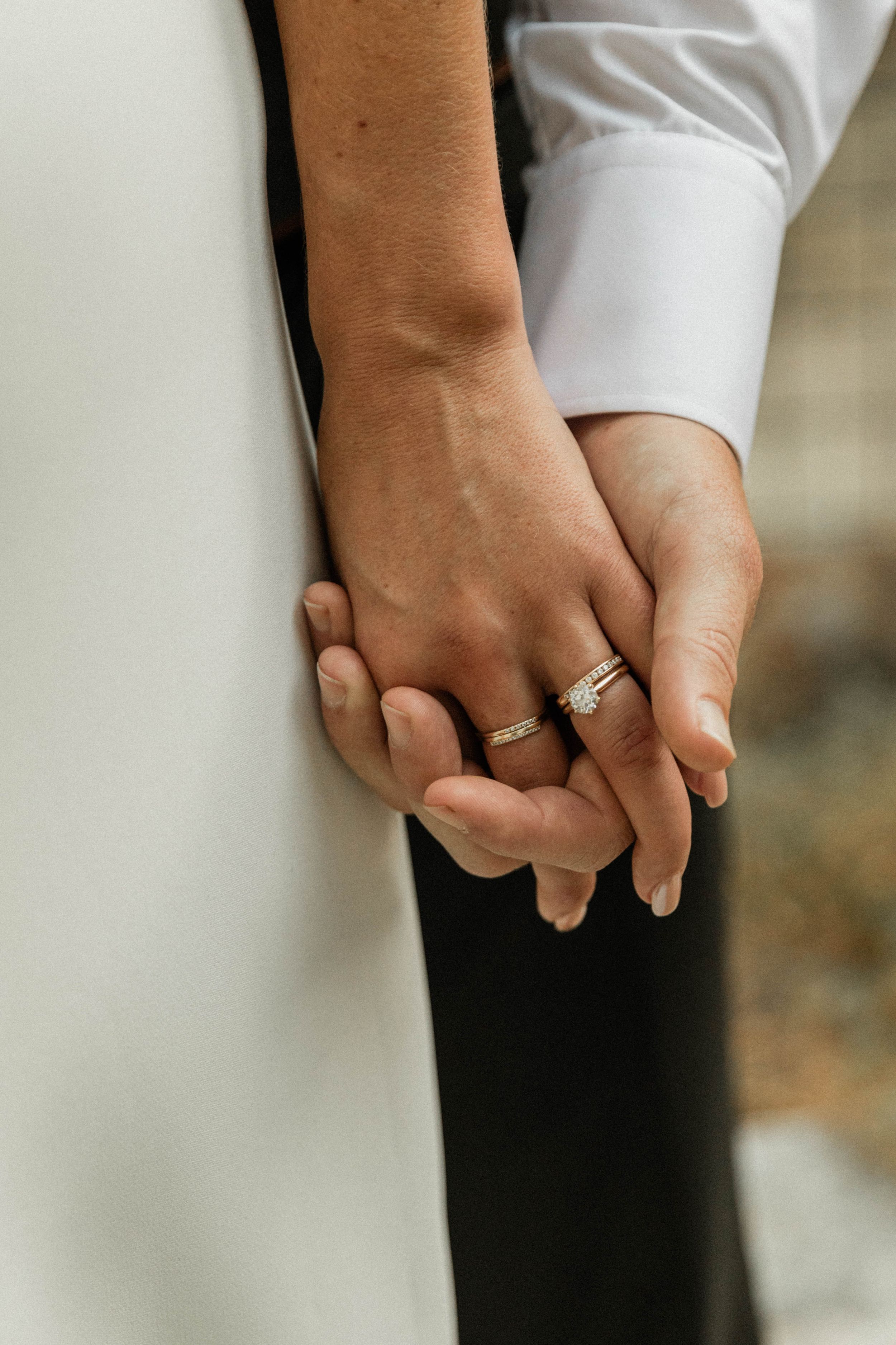 close up of Bride and groom's hands after exchanging vows in the Santa Cruz Mountains of California.