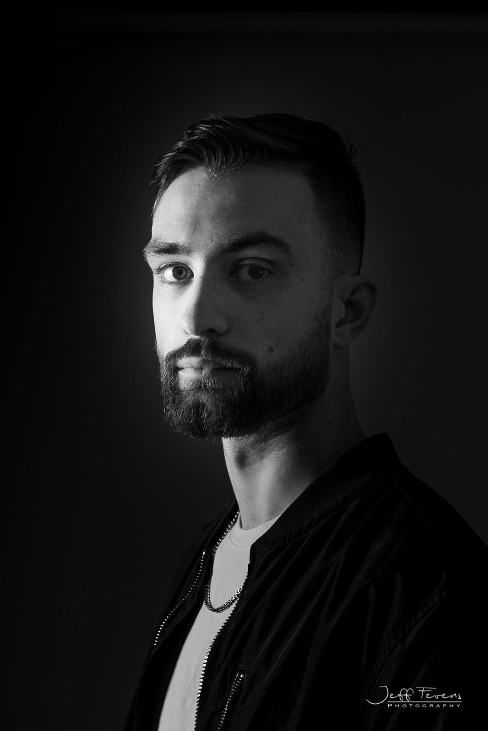 Black and White portrait of an man in studio.
